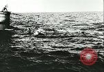 Image of German submarine U-564 reloads torpedo at sea Atlantic Ocean, 1942, second 45 stock footage video 65675062706