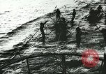 Image of German submarine U-564 reloads torpedo at sea Atlantic Ocean, 1942, second 48 stock footage video 65675062706