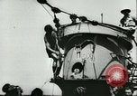 Image of German submarine U-564 reloads torpedo at sea Atlantic Ocean, 1942, second 58 stock footage video 65675062706