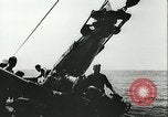 Image of German submarine U-564 reloads torpedo at sea Atlantic Ocean, 1942, second 61 stock footage video 65675062706