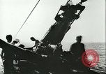 Image of German submarine U-564 reloads torpedo at sea Atlantic Ocean, 1942, second 62 stock footage video 65675062706