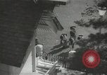 Image of Japanese children bow at shrine on the way to school Japan, 1939, second 1 stock footage video 65675062944