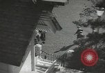 Image of Japanese children bow at shrine on the way to school Japan, 1939, second 5 stock footage video 65675062944