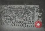 Image of Japanese children bow at shrine on the way to school Japan, 1939, second 20 stock footage video 65675062944