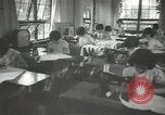 Image of Japanese children bow at shrine on the way to school Japan, 1939, second 32 stock footage video 65675062944