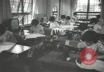 Image of Japanese children bow at shrine on the way to school Japan, 1939, second 33 stock footage video 65675062944