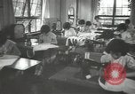 Image of Japanese children bow at shrine on the way to school Japan, 1939, second 34 stock footage video 65675062944