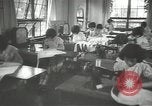 Image of Japanese children bow at shrine on the way to school Japan, 1939, second 35 stock footage video 65675062944