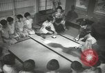 Image of Japanese children bow at shrine on the way to school Japan, 1939, second 39 stock footage video 65675062944