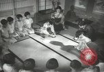 Image of Japanese children bow at shrine on the way to school Japan, 1939, second 40 stock footage video 65675062944