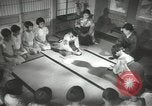 Image of Japanese children bow at shrine on the way to school Japan, 1939, second 41 stock footage video 65675062944