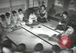 Image of Japanese children bow at shrine on the way to school Japan, 1939, second 43 stock footage video 65675062944
