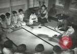 Image of Japanese children bow at shrine on the way to school Japan, 1939, second 44 stock footage video 65675062944