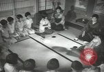 Image of Japanese children bow at shrine on the way to school Japan, 1939, second 45 stock footage video 65675062944