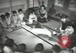 Image of Japanese children bow at shrine on the way to school Japan, 1939, second 46 stock footage video 65675062944