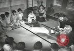Image of Japanese children bow at shrine on the way to school Japan, 1939, second 47 stock footage video 65675062944