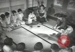 Image of Japanese children bow at shrine on the way to school Japan, 1939, second 49 stock footage video 65675062944