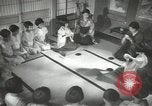 Image of Japanese children bow at shrine on the way to school Japan, 1939, second 52 stock footage video 65675062944