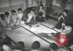 Image of Japanese children bow at shrine on the way to school Japan, 1939, second 54 stock footage video 65675062944
