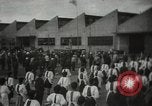 Image of Workers exercise before entering a factory Japan, 1939, second 1 stock footage video 65675062946