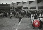 Image of Workers exercise before entering a factory Japan, 1939, second 6 stock footage video 65675062946