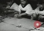 Image of Workers exercise before entering a factory Japan, 1939, second 28 stock footage video 65675062946