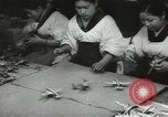 Image of Workers exercise before entering a factory Japan, 1939, second 29 stock footage video 65675062946
