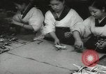 Image of Workers exercise before entering a factory Japan, 1939, second 30 stock footage video 65675062946