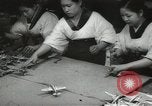 Image of Workers exercise before entering a factory Japan, 1939, second 31 stock footage video 65675062946