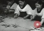 Image of Workers exercise before entering a factory Japan, 1939, second 32 stock footage video 65675062946