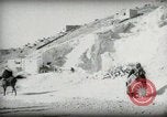 Standbild kleiner Junge zu Fuß und mit Kamelen Amman Transjordan, 1945, aus Sekunde 26 historischem Filmmaterial Videoclip 65675062976