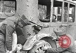 Image of US soldiers examine gunfire damaged car France, 1917, second 3 stock footage video 65675063072