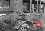 Image of US soldiers examine gunfire damaged car France, 1917, second 4 stock footage video 65675063072