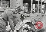 Image of US soldiers examine gunfire damaged car France, 1917, second 6 stock footage video 65675063072