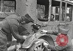 Image of US soldiers examine gunfire damaged car France, 1917, second 7 stock footage video 65675063072