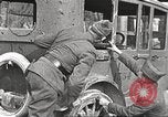 Image of US soldiers examine gunfire damaged car France, 1917, second 9 stock footage video 65675063072