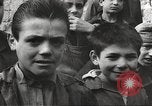 Image of European children and adults scavenge for food and relief after war Europe, 1945, second 3 stock footage video 65675063144