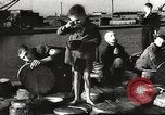 Image of European children and adults scavenge for food and relief after war Europe, 1945, second 24 stock footage video 65675063144