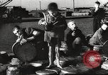 Image of European children and adults scavenge for food and relief after war Europe, 1945, second 25 stock footage video 65675063144