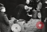 Image of European children and adults scavenge for food and relief after war Europe, 1945, second 38 stock footage video 65675063144