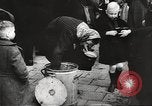 Image of European children and adults scavenge for food and relief after war Europe, 1945, second 39 stock footage video 65675063144