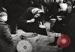 Image of European children and adults scavenge for food and relief after war Europe, 1945, second 40 stock footage video 65675063144