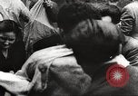 Image of European children and adults scavenge for food and relief after war Europe, 1945, second 59 stock footage video 65675063144