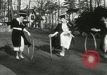 Image of hoop-rolling contest Wellesley Massachusetts USA, 1933, second 35 stock footage video 65675063201
