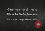 Image of dam on Zuider Zee Netherlands, 1940, second 57 stock footage video 65675063271