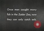 Image of dam on Zuider Zee Netherlands, 1940, second 61 stock footage video 65675063271
