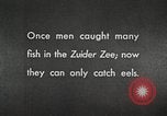 Image of dam on Zuider Zee Netherlands, 1940, second 62 stock footage video 65675063271
