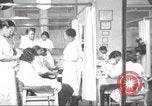 Immagine di Salone di bellezza per donne afroamericane ad Harlem New York City USA, 1940, secondo 15 filmato di repertorio 65675063284