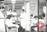 Immagine di Salone di bellezza per donne afroamericane ad Harlem New York City USA, 1940, secondo 16 filmato di repertorio 65675063284