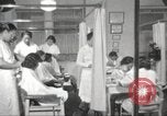Immagine di Salone di bellezza per donne afroamericane ad Harlem New York City USA, 1940, secondo 17 filmato di repertorio 65675063284